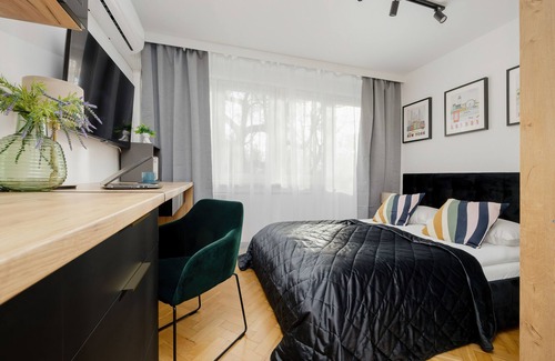 Okecie Apartamento | Black & Wooden Apartment by Renters