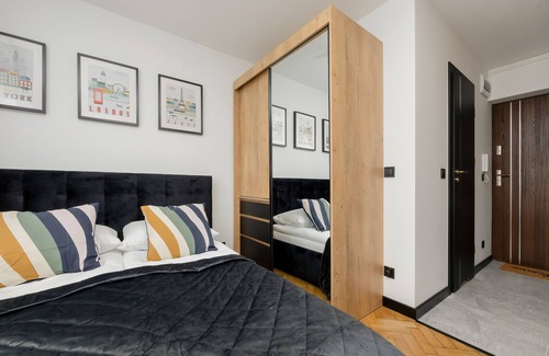 Okecie Apartamento | Black & Wooden Apartment by Renters