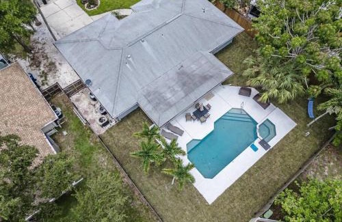 Palma Sola Casa | Blue Palm Home with Pool, Hot Tub, Nearby Beach, Outdoor Shower