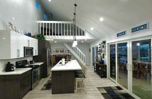 Gulf Cove Casa | Breath taking canal, pool home with golf access. 15 minutes from beaches.