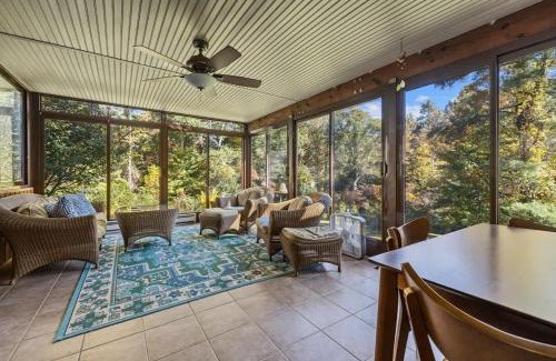 Hendersonville Casa | Bright 2BR Cabin with Sunroom Firepit Near Trails
