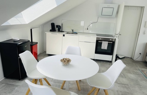 Karthause Condominio | Bright, spacious attic apartment.