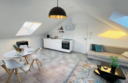 Karthause Condominio | Bright, spacious attic apartment.