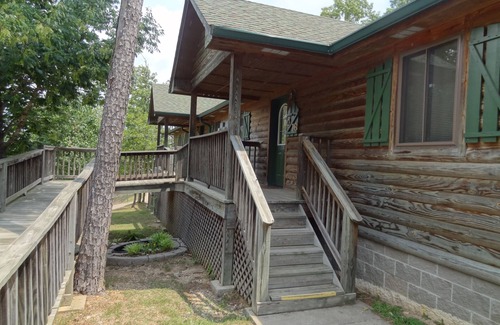 Mount Ida Cabaña | C16, Two bedroom, two bath, log-sided Harbor North luxury cottage with hot tub overlooking Lake Ouachita. by RedAwning