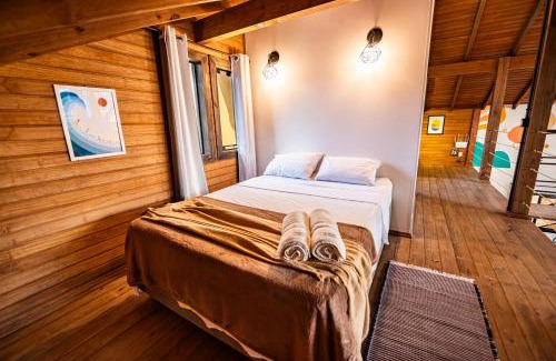 Vila Esperanca Casa | Cabana Perfeita a 800m da Praia - Lareira externa, Quintal Amplo, Pet Friendly, Ar condicionado, Netflix e Conforto completo