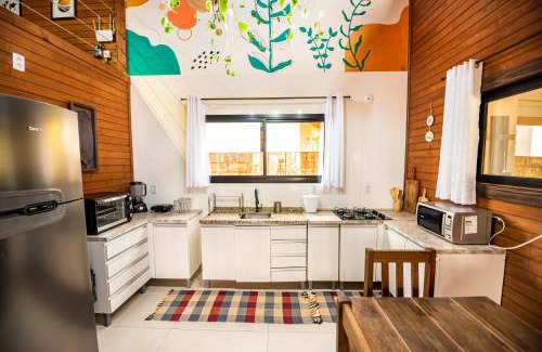 Vila Esperanca Casa | Cabana Perfeita a 800m da Praia - Lareira externa, Quintal Amplo, Pet Friendly, Ar condicionado, Netflix e Conforto completo