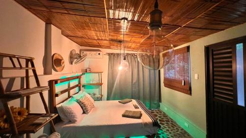 Taganga Apartamento | Cabin with balcony and ocean view.