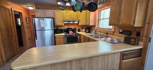 Swanton Casa | Camp Valentine- charming 3 bedroom cabin with hot tub and fireplace in private setting