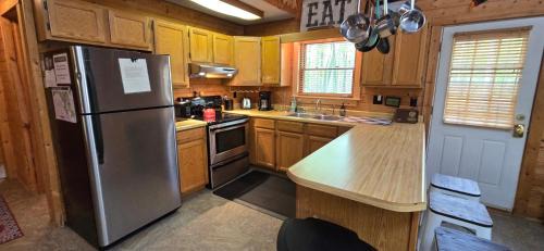 Swanton Casa | Camp Valentine- charming 3 bedroom cabin with hot tub and fireplace in private setting