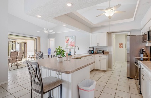 Pebble Beach Casa | Canal-front home with sandy beaches, golf courses, dock, & refreshing pool