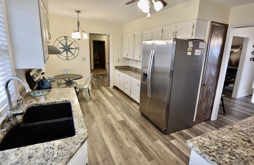 Frisco Casa | Canal Front Home with a Dock and Hot Tub minutes from the beach!