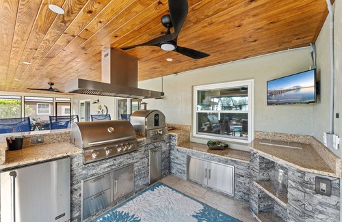 Cocoa Isles Country Club Casa | Casa Coco Retreat w/Heated Pool & Outdoor Kitchen!