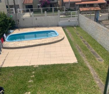 Tramandai Casa | Casa com 4 quartos e piscina pra aproveitar