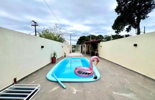 Guaratuba Casa | Casa com piscina , ar condicionado e churrasqueira no balneário Eliana