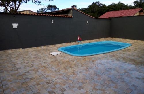 Peruibe Casa | Casa com piscina em condomínio fechado