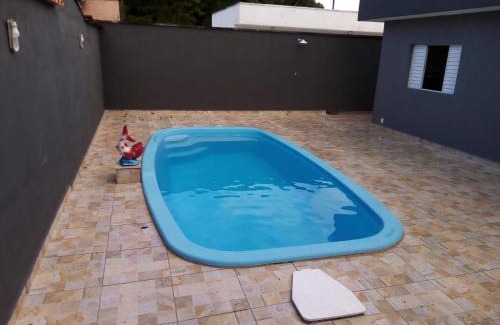 Peruibe Casa | Casa com piscina em condomínio fechado