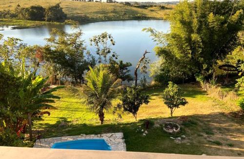 Ijaci Casa | Casa com piscina fundo pra represa e AR Condicionado CasinhaBrancaDeVaranda