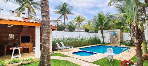Jardim Acapulco Casa | Casa com piscina, varanda e lazer em condomínio