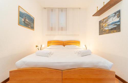 Sala Comacina Apartamento | Casa con parcheggio, piscina giardino, barbecue