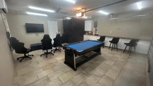 Cocoa Isles Villa | Casa De Olas - Waterfront Luxe Home - Heated Pool - Game Room - Boat Lift - Minutes to Beach