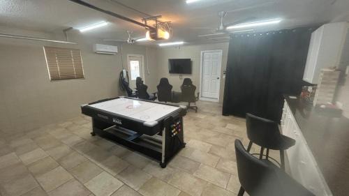 Cocoa Isles Villa | Casa De Olas - Waterfront Luxe Home - Heated Pool - Game Room - Boat Lift - Minutes to Beach