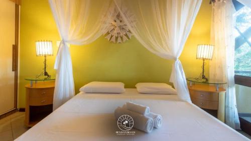 Arraial d'Ajuda Casa | Casa em Arraial D'ajuda - Praia do Mucugê - Bahia - 40mts da praia - Ar condicionado - Churrasqueira - Smart Tv - Wifi - Piscina - Vaga para carro