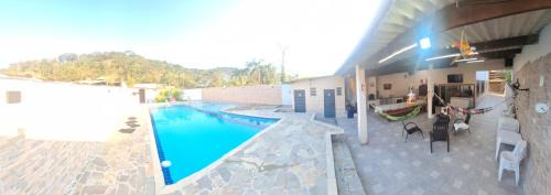 Caiubura Casa | Casa em Bertioga com piscina aquecida