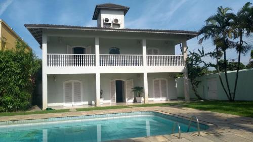 Balneario Praia do Pernambuco Casa | Casa Eventos e Temporada com 4 suites, piscina, churrasqueira, Wi-Fi, Ar Condicionado - Proximo Praia Mar Casado e Pernambuco - Guaruja -