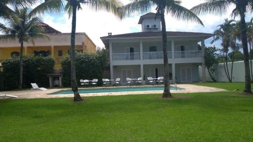 Balneario Praia do Pernambuco Casa | Casa Eventos e Temporada com 4 suites, piscina, churrasqueira, Wi-Fi, Ar Condicionado - Proximo Praia Mar Casado e Pernambuco - Guaruja -
