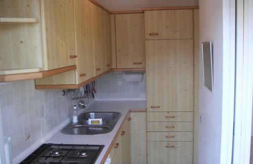 Montelago-San Gottardo Apartamento | Apartamento con vista al lago, terraza jardín y playa privada.