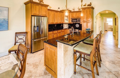 Coury Casa | Casa Paraiso: Discover This Charming 2BR Canal Front Duplex in KCB with Private Pool & Dockage!