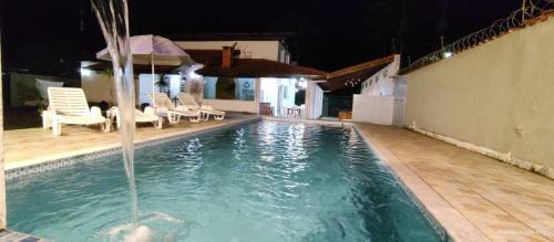 Jardim Neptunia Casa | Casa piscina pé na areia Bertioga