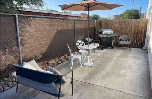 Limberlost Casa | Casita A: Private fenced yard with grill, turf, outdoor dining and seating.