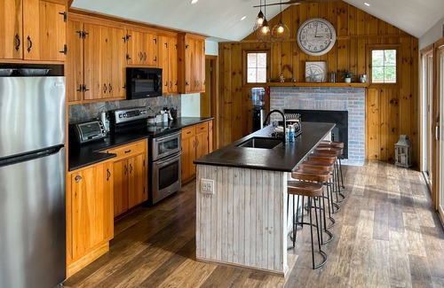 Pine River Pond Casa | Central lakefront house with private hot tub, dock, patio bar, & beach access