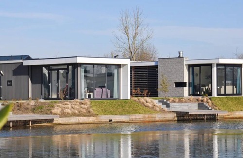 Nunspeet Chalet De Esquí | Chalet sobre el agua en el hermoso Veluwemeer