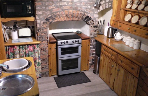 Aldbrough Cabaña | Casa de carácter con chimenea y techos con vigas