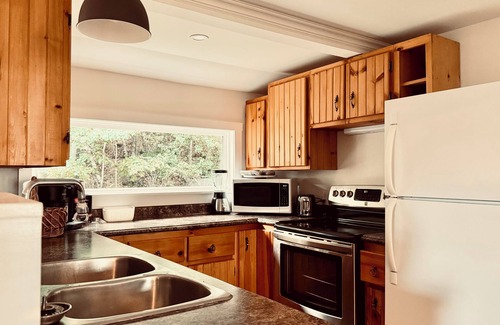 Yarmouth County Cabaña | Charming 2-bedroom cottage with barrel sauna and river view