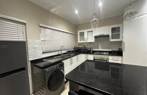 Harare Casa | Charming 2-bedroom house in peaceful Harare with a Pool ,AC, WiFi & fitness room
