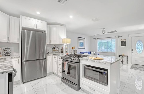Florida North Atlantic Coast Casa | Charming 3BR Canal Home w/patio dining, Fire Pit & Workspace