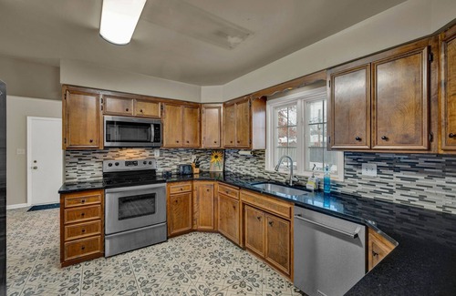 Topeka Casa | Charming 4BR family home w/ private deck off master, big yard and patio
