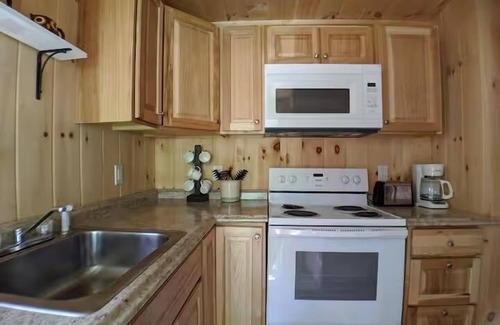 Raymond Cabaña | Charming Getaway with Screened Porch, Deck, and Scenic Lake Views