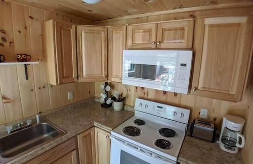 Raymond Cabaña | Charming Getaway with Screened Porch, Deck, and Scenic Lake Views