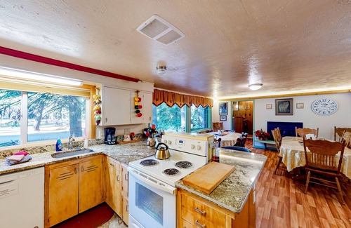 Joseph Casa | Charming Wallowa Lake home with forest views, fireplace, & private W/D