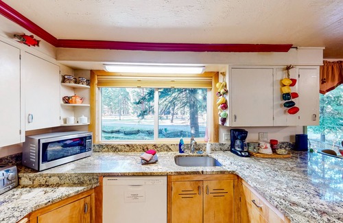 Joseph Casa | Charming Wallowa Lake home with forest views, fireplace, & private W/D