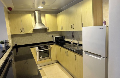Doha Apartamento | Chic 1-bedroom apartment with AC, fitness room, WiFi in enchanting Doha