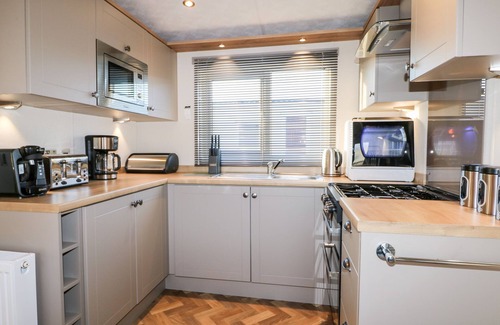 Chichester Cabaña | CHICHESTER LAKESIDE HOLIDAY PARK, pet friendly in Chichester