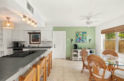 River Isles Casa | Coconut cove - peaceful garden retreat with HEATED pool on canal near the beach!
