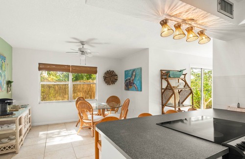 River Isles Casa | Coconut cove - peaceful garden retreat with HEATED pool on canal near the beach!