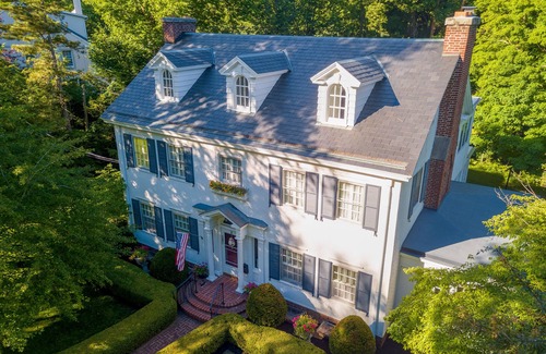 Sidney Casa | Colonial Home on Wooded Lot