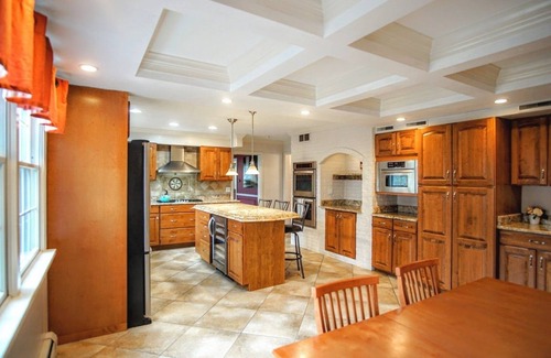 Benton Harbor Casa | Colonial style 5BR/5BA home tucked in a private, wooded setting w/pool & hot tub